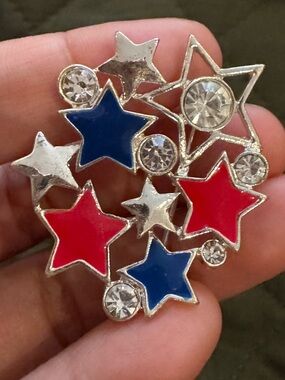 Red, White and Blue Star pin with silver gemstone and stars.